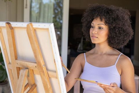 Talented Artist Painting Outdoors on Patio