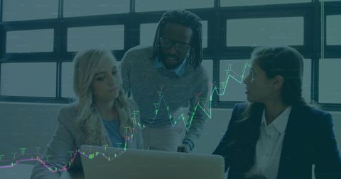 Diverse Professionals Analyzing Financial Data in Modern Office Setup