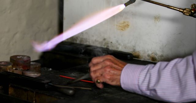 Senior Craftsperson Using Torch in Jewelry Making Workshop - Download Free Stock Images Pikwizard.com