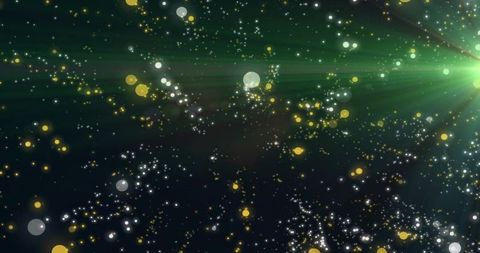 Green cosmic light burst with bokeh particles and lens flare abstract background