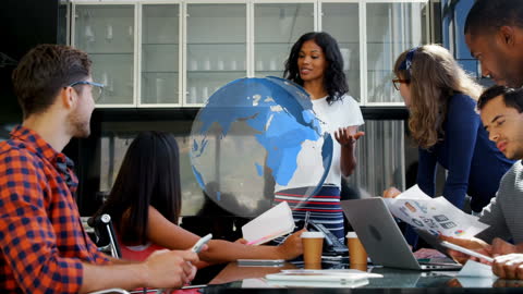 Diverse Team Brainstorming with Futuristic Digital Globe Overlay