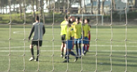 Youth Soccer Team Preparing for Training on Field