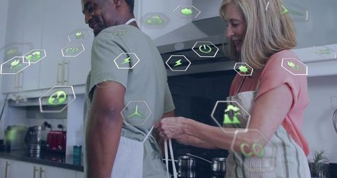 Couple Cooking Together in Modern Kitchen, Partner Tying Apron with Eco Energy Icons