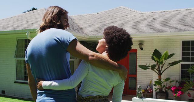 Rear view of happy biracial couple looking at their new house - Download Free Stock Photos Pikwizard.com