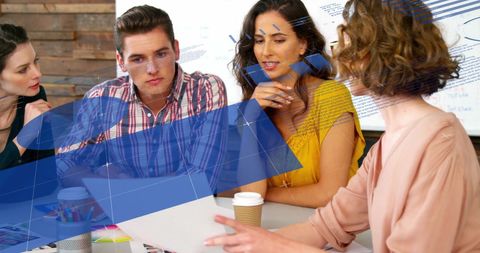 Diverse Business Team Analyzing Financial Data Visuals in Office