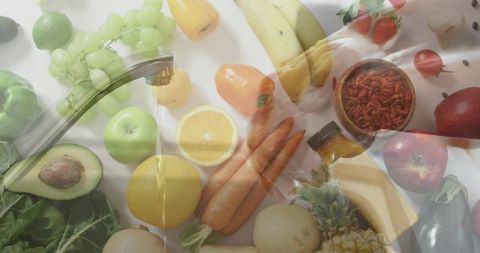 Mid-adult woman rinsing assorted fresh produce at kitchen sink for healthy home meal prep