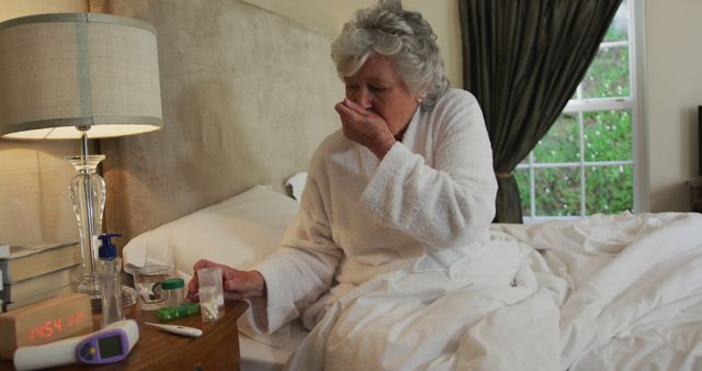 Elderly Woman In Bed Coughing Beside Medication At Night - Download Free Stock Images Pikwizard.com
