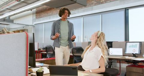 Colleagues Celebrating Success Together in Modern Office