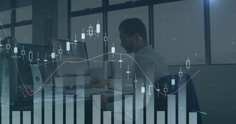 Financial analyst studying data with chart overlay in modern office