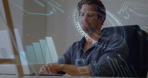 Adult man analyzing data with futuristic hud overlay while working on laptop