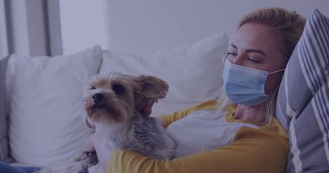 Woman Relaxing on Couch with Dog During Quarantine