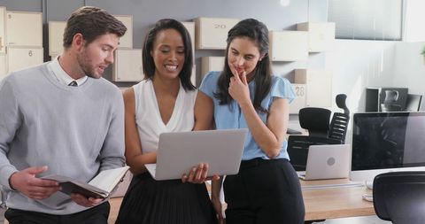 Diverse Team Collaborating in Modern Office with Shared Ideas - Download Free Stock Images Pikwizard.com