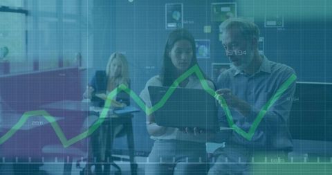 Team Collaborating in Modern Office with Digital Line Chart Overlay
