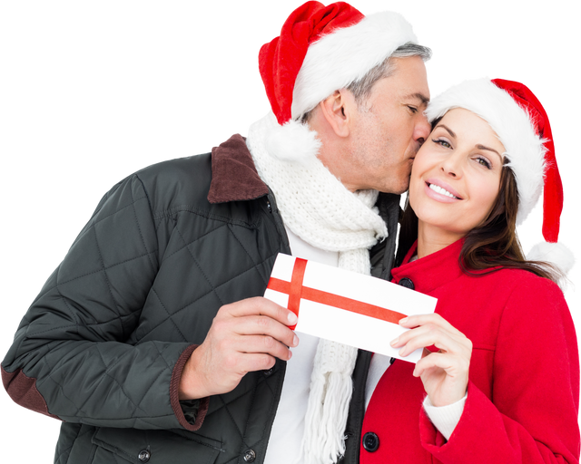 Festive Romantic Couple in Santa Hats Holding Christmas Gift and Kissing - Download Free Stock Videos Pikwizard.com