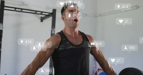 Muscular man lifting barbell in intense gym workout with social media overlays