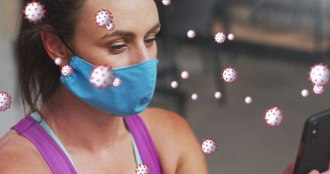 Woman Wearing Mask in Gym Checking Smartphone During Pandemic