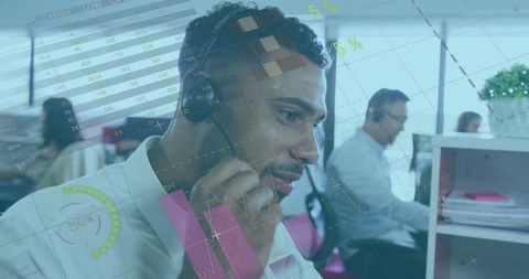 Businessman Using Headset in Call Center with Overlaid Data Graphics