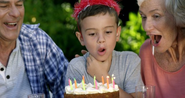 A boy's birthday celebration with his grandparents highlights the joy of family milestones. - Download Free Stock Photos Pikwizard.com