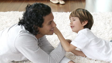 Father and Son Bonding on Cozy Carpet at Home