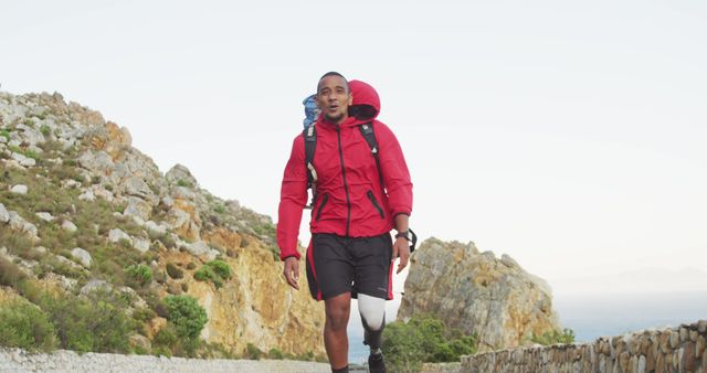 Single Leg Amputee Hiking Outdoors in Red Jacket - Download Free Stock Images Pikwizard.com