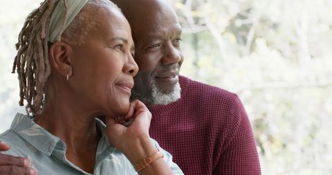 Loving Senior Couple Embracing and Enjoying Nature View