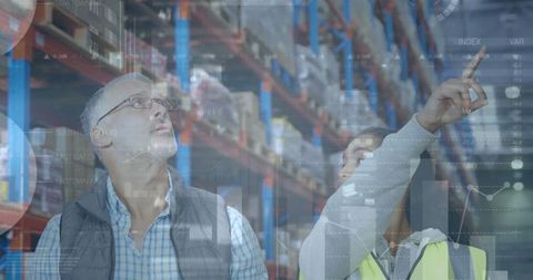 Warehouse planners analyzing data with augmented reality display