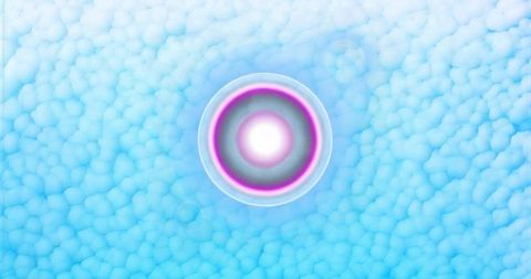 Glowing concentric disc pulsing over textured blue pebble field futuristic luminous abstract