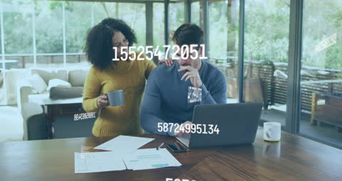 Couple Collaborating on Laptop with Data Visualization Overlay