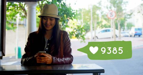 Smiling Woman Texting with Social Media Love Counter