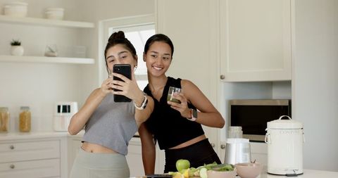 Friends in Sportswear Taking Selfie with Healthy Smoothie in Kitchen