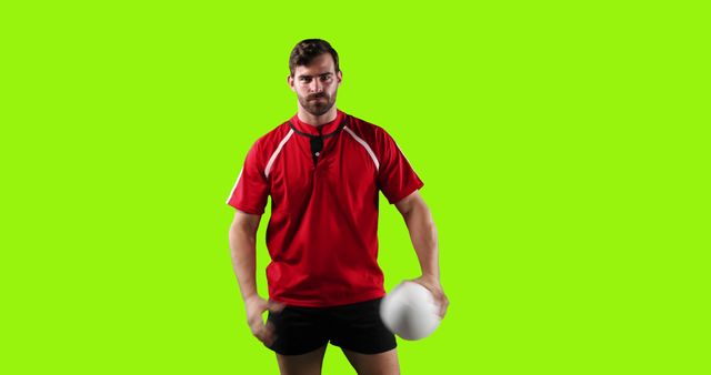 Rugby Player Holding Ball on Green Background - Download Free Stock Images Pikwizard.com