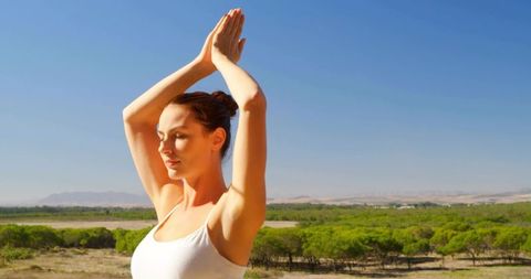 Woman Practicing Yoga in Nature, Finding Tranquility and Mindfulness