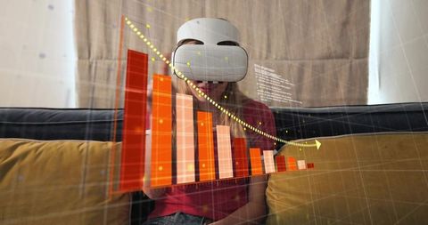 Young woman viewing immersive ar data dashboard with vr headset on living room sofa at home