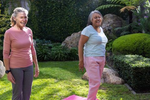 Senior Women Engaging in Outdoor Fitness and Enjoying Conversation