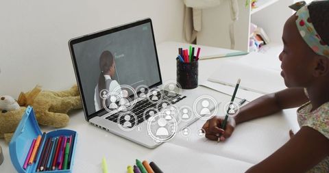 African american schoolgirl online learning with teacher on laptop