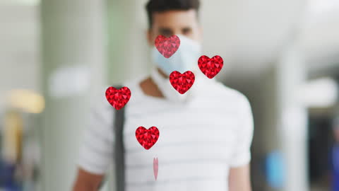 Caucasian Man Wearing Face Mask Behind Floating Hearts