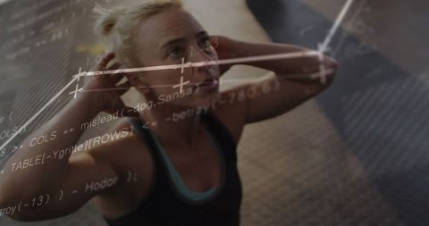 Blonde athlete performing crunches with futuristic code and data overlay in gym studio