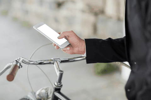 Businessman Holding Smartphone with Transparent Screen on City Street - Download Free Stock Videos Pikwizard.com