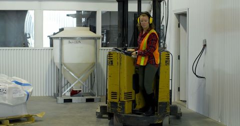 Female Worker Operating Forklift in Industrial Warehouse - Download Free Stock Images Pikwizard.com