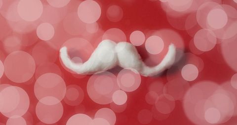 White Mustache Decoration on Red Bokeh Background for Festive Celebrations