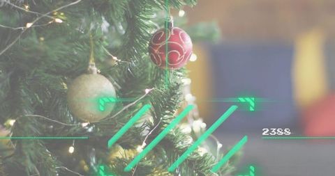 Holiday ornament close-up with red swirl bauble, gold ball, warm lights and digital hud