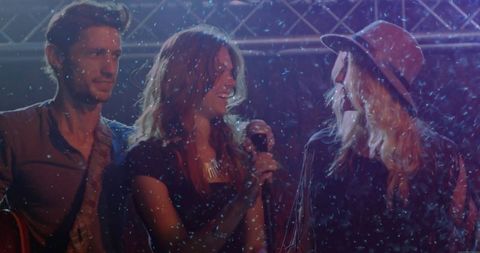 Trio Performing in Concert with Snow Effects and Dynamic Lighting