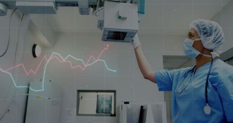 Radiology Technologist Adjusting Imaging Equipment in Modern Healthcare Setting