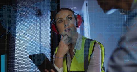 Female it engineer analyzing server data with tablet