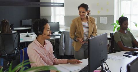 Two Businesswomen Collaborating at Office Desk - Download Free Stock Images Pikwizard.com