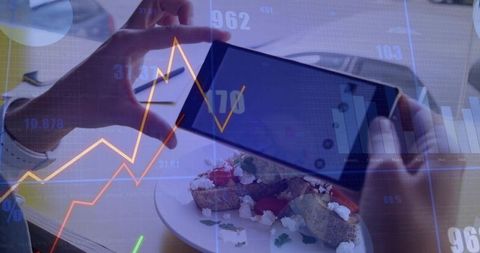 Hands Using Tablet in Cafe with Market Trends Overlay