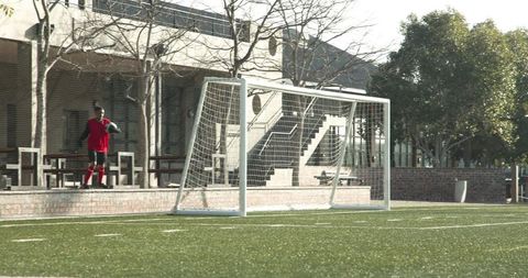 Youth soccer players engaged in strategic game on field