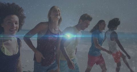 Five Friends Laughing Together on Starry Beach with Lens Flare Effect