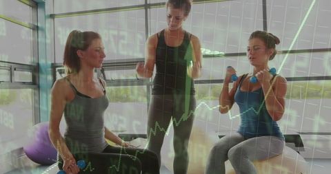 Personal Trainer Guiding Clients Lifting Dumbbells in Studio with Chart Overlay