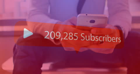 Man Holding Smartphone With Growing Subscriber Counter